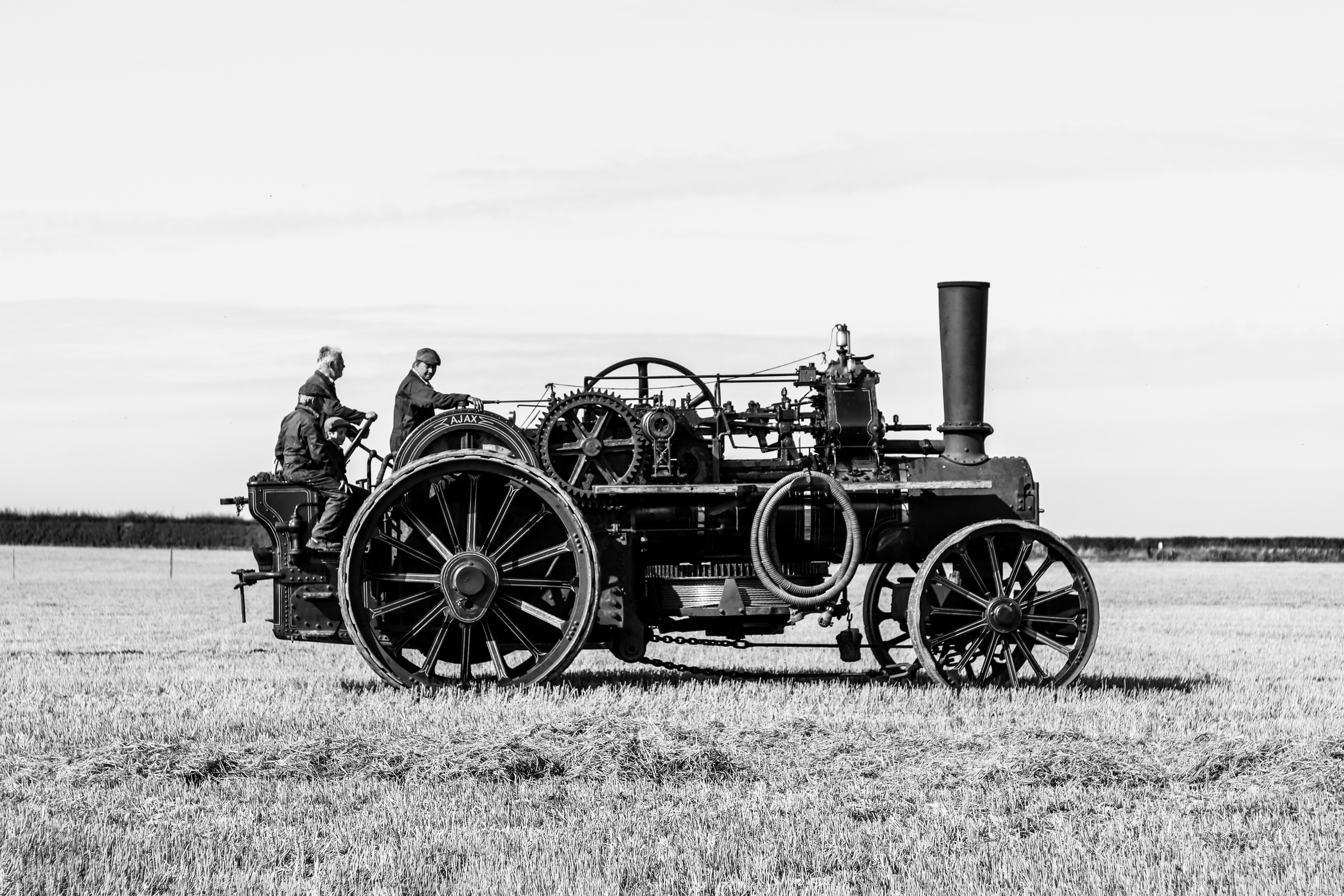 A traction steam engine in an open field